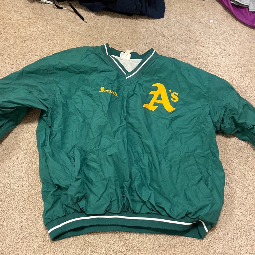 A’s windbreak crew neck. Size XL. Brand is Rawlings